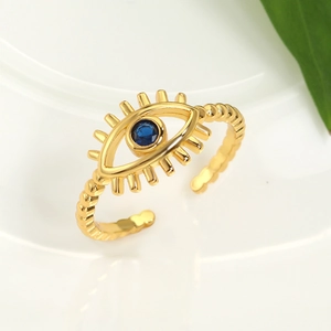 Detailed macro view of the gold Evil Eye adjustable ring with blue center stone