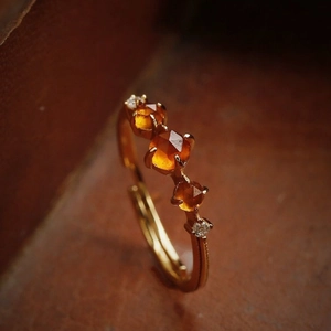 Retro adjustable gold ring with three faceted orange garnets and side accents