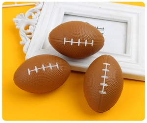 Detailed view of three brown foam stress balls with white stitching on yellow background