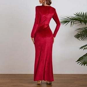 Back view of elegant red velvet long-sleeve evening gown with high slit and slim fit