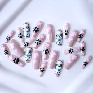 Medium coffin press-on nails with cartoon puppy, heart patterns, and pink nude finish