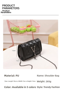 Close-up of black quilted shoulder bag featuring metal V-logo with elegant fringe detail