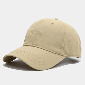 Detail view of khaki cotton baseball cap showing 6-panel structure and vent holes