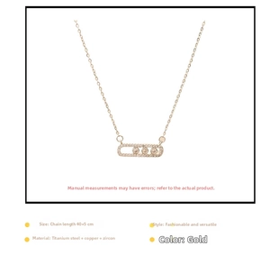 Detail of gold geometric necklace with three moving zircons and 40+5cm chain length