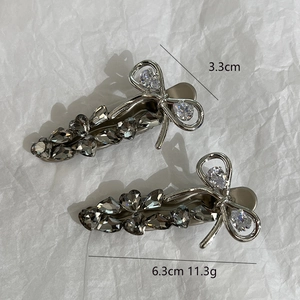 Bow hair clip measurements showing 6.3cm length and 3.3cm width with silver rhinestones