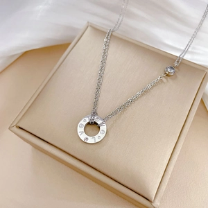 Detailed macro view of silver titanium steel LOVE ring pendant with crystal inlays
