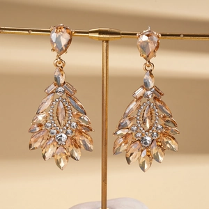 Elegant gold-tone drop earrings with amber crystals in a vintage palace style design