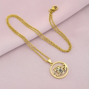 Detail of 18K gold-plated evil eye pendant necklace with colorful cubic zirconia stones