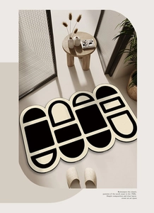 Abstract black and white geometric anti-slip bath mat in a modern home hallway setting