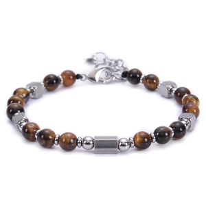 Macro shot of tiger eye beads and square metal pieces on an adjustable steel bracelet
