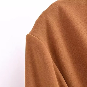 Brown knit maxi dress with elegant cowl neck and refined ribbed texture for autumn fashion