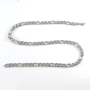 Detailed close-up of a silver Figaro chain necklace in a retro hip-hop punk style