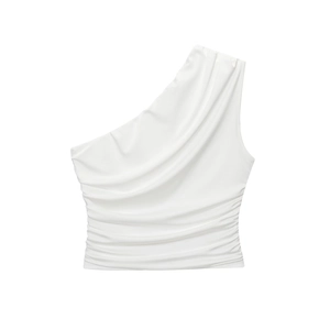 Detail shot of white one-shoulder top showing fine pleated texture and elastic fabric