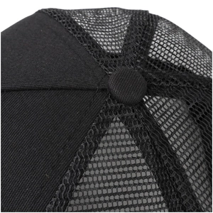 Macro shot of durable black fabric stitching and breathable mesh panel on a trucker hat