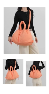 Macro detail of orange padded nylon tote showing versatile backpack and shoulder straps