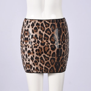 Close-up of sequined leopard print mini skirt with knotted design and tight fit detail