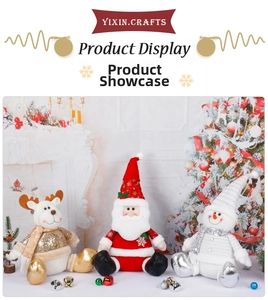 Detail of plush Santa, snowman and reindeer figures with sequins by a Christmas tree