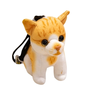 Cute orange and white plush tabby cat keychain with a black strap on white background