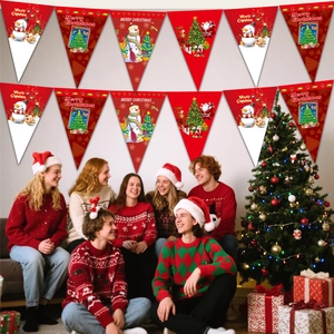 Christmas party decoration bunting with Santa and snowman patterns hanging on a festive wall