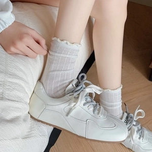 White cotton mesh socks with ruffle trim paired with sneakers in Japanese style