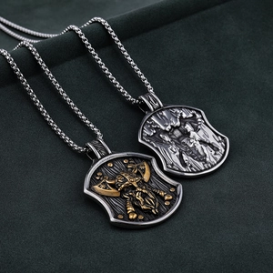 Viking shield pendant necklace with double axes in stainless steel on green velvet