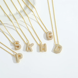 Chic 3D bubble letter pendant necklace with gold plating and sparkling cubic zirconia stones