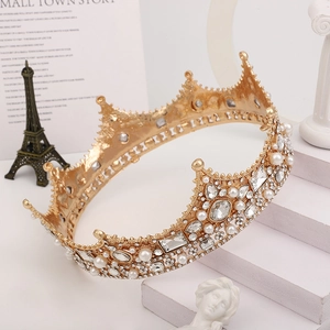 Detailed view of Baroque queen crown with pearls and rhinestones on golden metal base