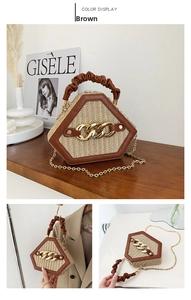 Detail of beige woven shell bag featuring brown leather trim and golden chain handle