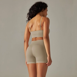 Detail of grey-green yoga set showing breathable knitted fabric and open back design