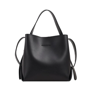 Minimalist black leather bucket bag with handle and shoulder strap on white background