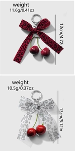 Detailed views of red and silver leopard print bow cherry keychains with specifications