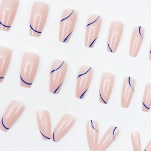 Long ballerina press-on nails with deep blue irregular stripes on a nude pink base