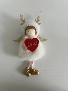 Detail of plush Christmas angel ornament with golden antlers and a red Love heart