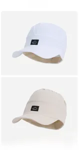 Detail of the fold-top sun visor showing the mountain logo patch and breathable fabric