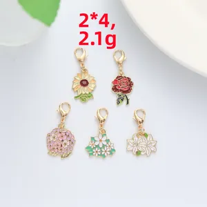 Detailed close-up of floral enamel pendants with lobster clasp, 2x4cm size and 2.1g weight