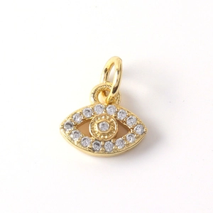 Detail of 14K gold plated evil eye pendant with sparkling white cubic zirconia inlay