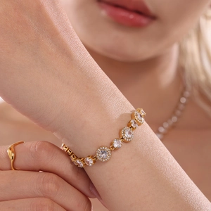 Elegant gold plated stainless steel tennis bracelet with 5A zircon crystals on woman's wrist