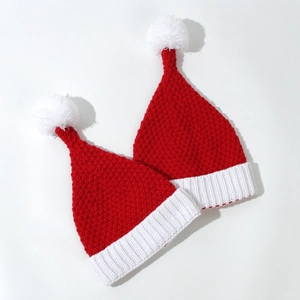 Chunky knit Christmas hats in red and white with soft pom-poms for festive parties