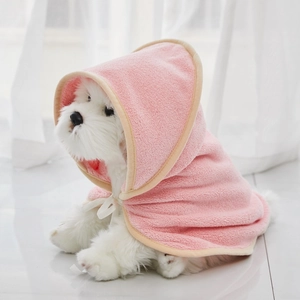 Close-up of pink microfiber pet bathrobe with soft hood and bow tie for small dogs