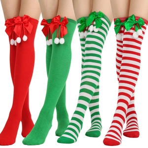Christmas over-the-knee socks with festive bow ties and pom-poms in striped patterns