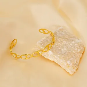 Elegant gold-plated stainless steel open bracelet featuring a stylish anchor link design