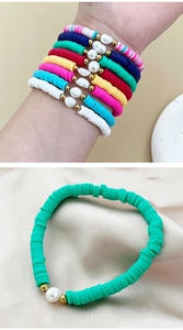 Close-up of Bohemian heishi bead bracelet with natural pearls and colorful clay discs