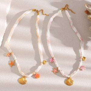 18K gold plated ribbon necklace with seashell and starfish charms on fabric cord