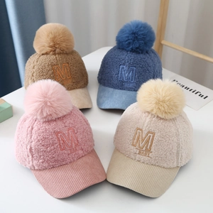 Kids warm teddy fleece baseball cap with fuzzy pom pom and embroidered letter M detail