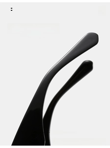 Close-up of black curved mirror legs with ergonomic design for comfortable eyewear fit
