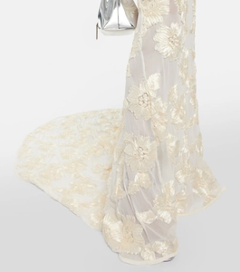 Detail of white tube fishtail evening dress featuring luxury 3D floral lace embroidery tail