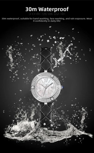 Macro view of silver watch with rhinestone bezel and water splash showing 30m waterproof