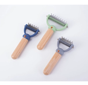 Detailed macro view of pet de-matting combs with wooden handles and sharp steel blades