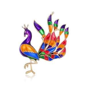 Detailed macro view of a colorful enamel peacock brooch with gold-toned metal accents
