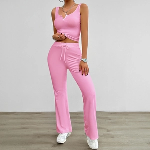 Pink yoga sports set with sleeveless button top and drawstring flare pants for women